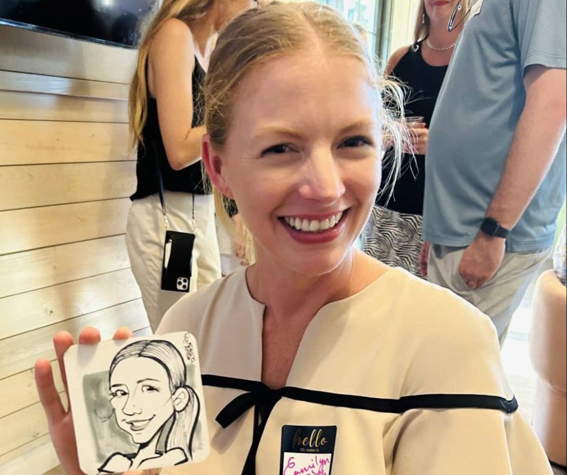woman holding caricature of herself