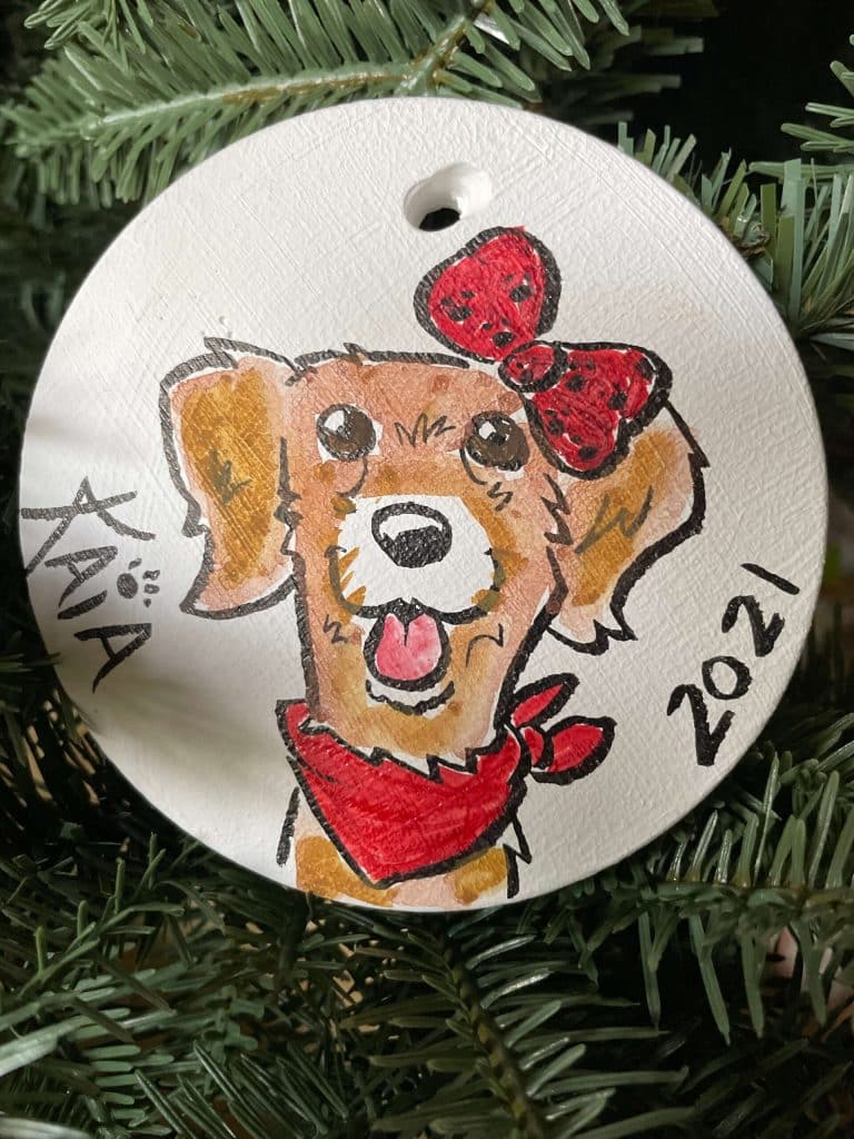 ornament with dog's face drawn on it