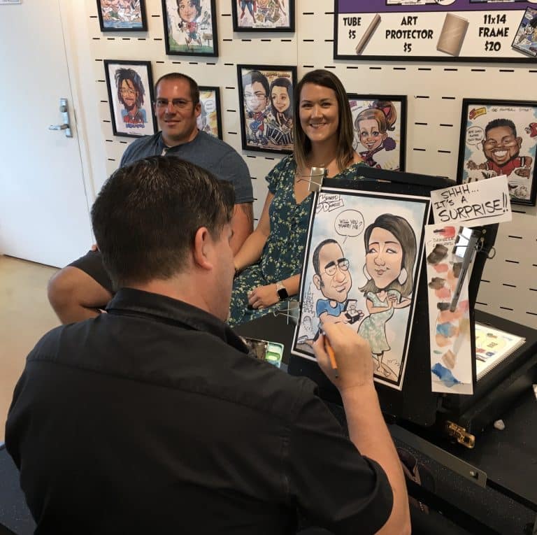 artist drawing caricature of a couple