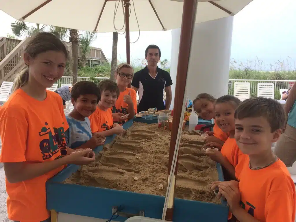 Kids standing by sandbox at creation