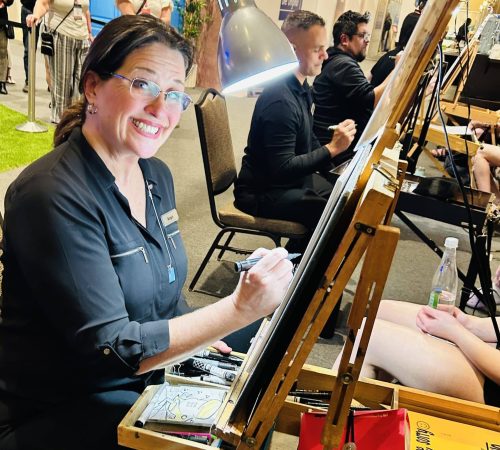 Artist smiling while working at easel