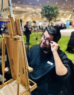 Caricaturist sketching people at a party